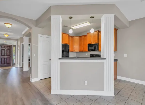 a view of a kitchen from the hallway