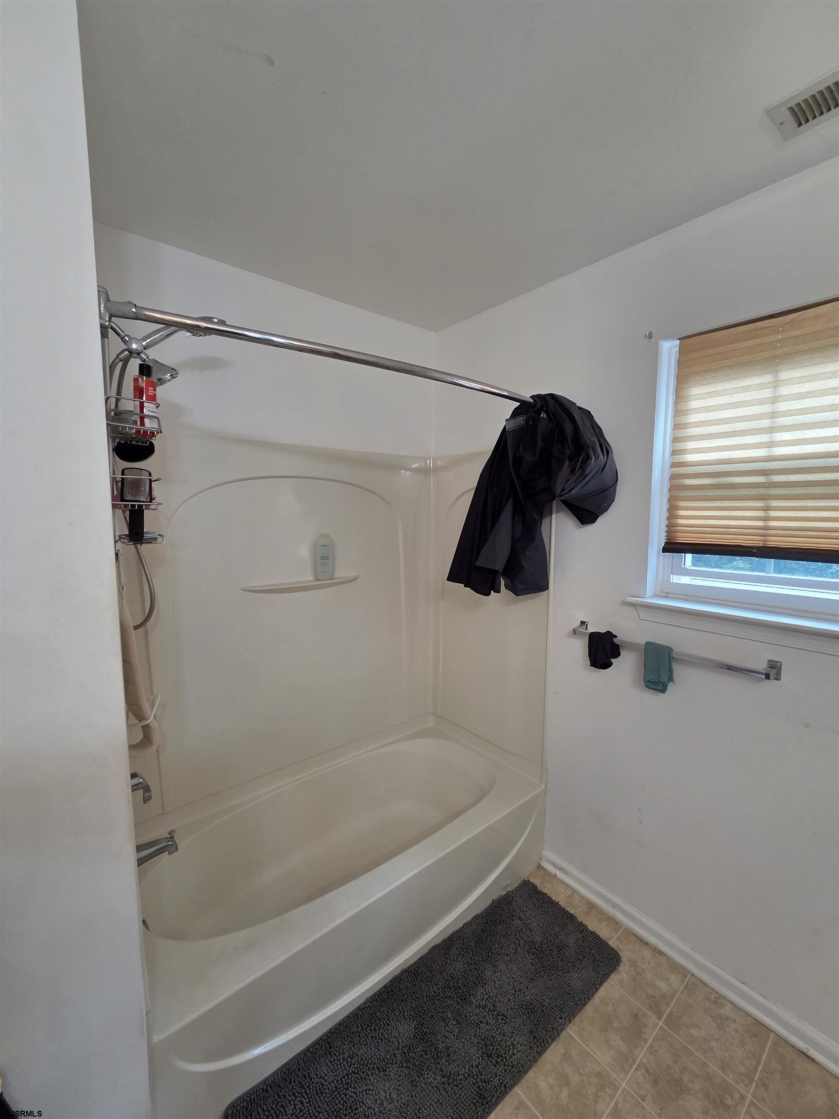 148 Natalie Road, Unit 148 Riverside, NJ 08075 - Photo 16 of 18 a bathroom with a bathtub and a shower