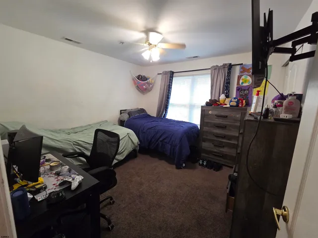 a bedroom with bed and window