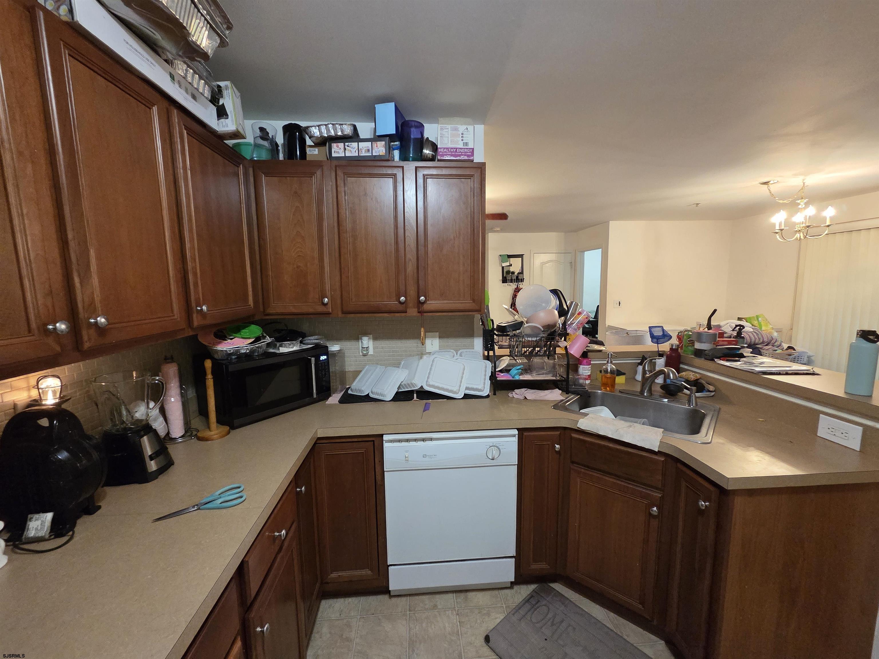 148 Natalie Road, Unit 148 Riverside, NJ 08075 - Photo 10 of 18 a kitchen with a sink cabinets and appliances