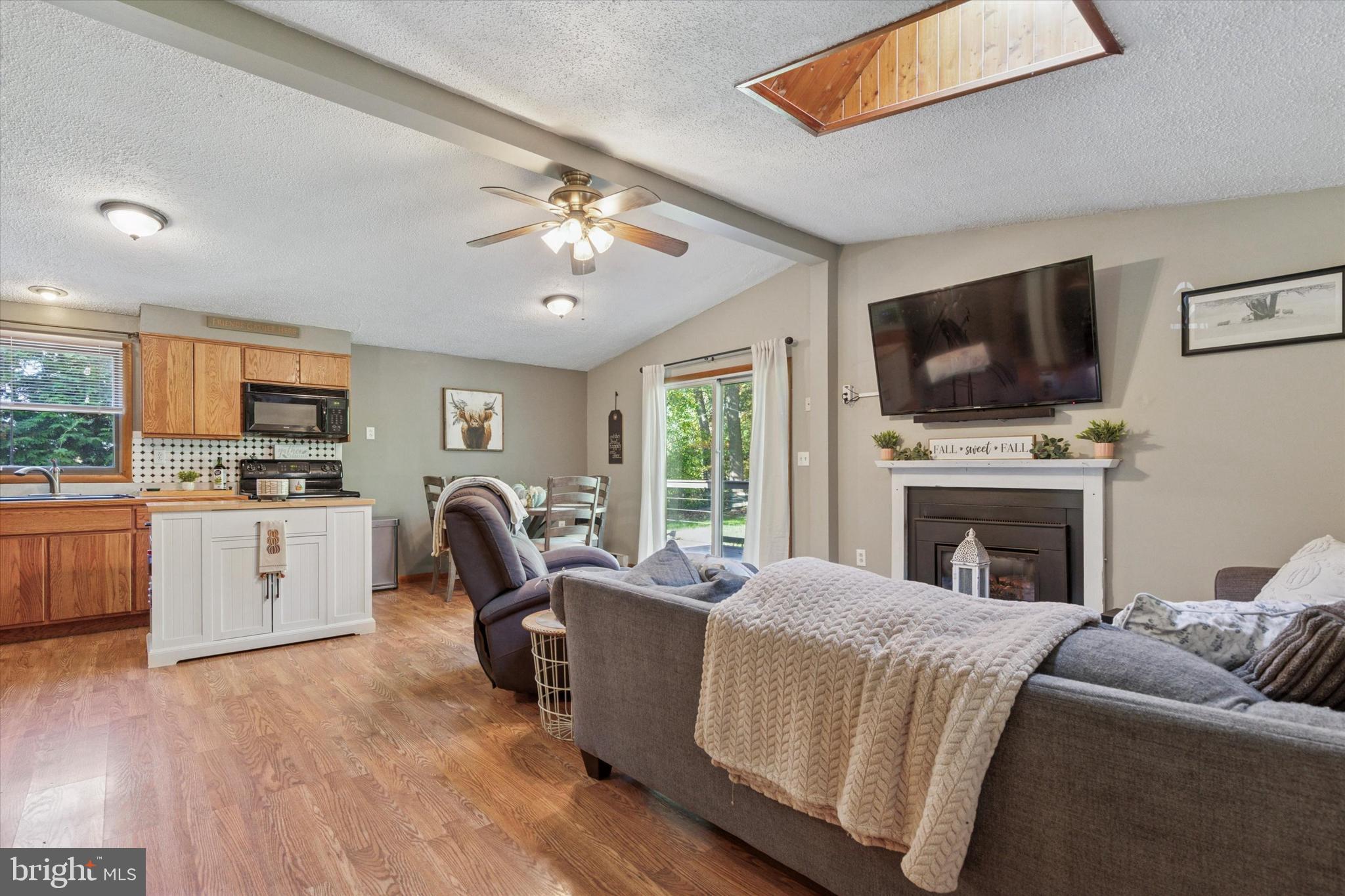 105 Cambridge Road Coatesville, PA 19320 - Photo 5 of 21 a living room with furniture fireplace and flat screen tv