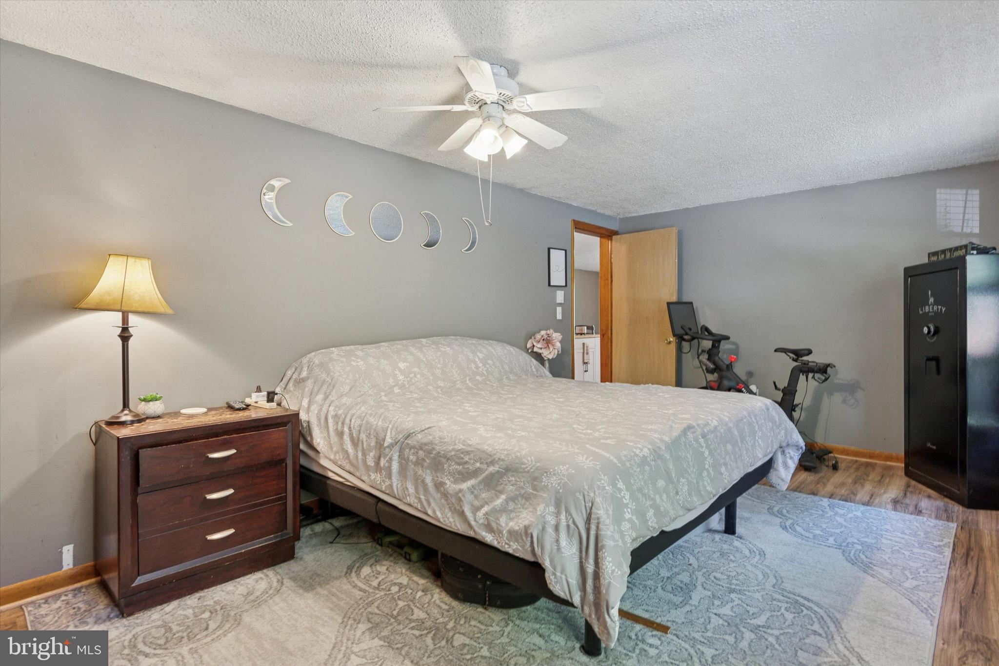 105 Cambridge Road Coatesville, PA 19320 - Photo 8 of 21 a bedroom with a bed and a chandelier