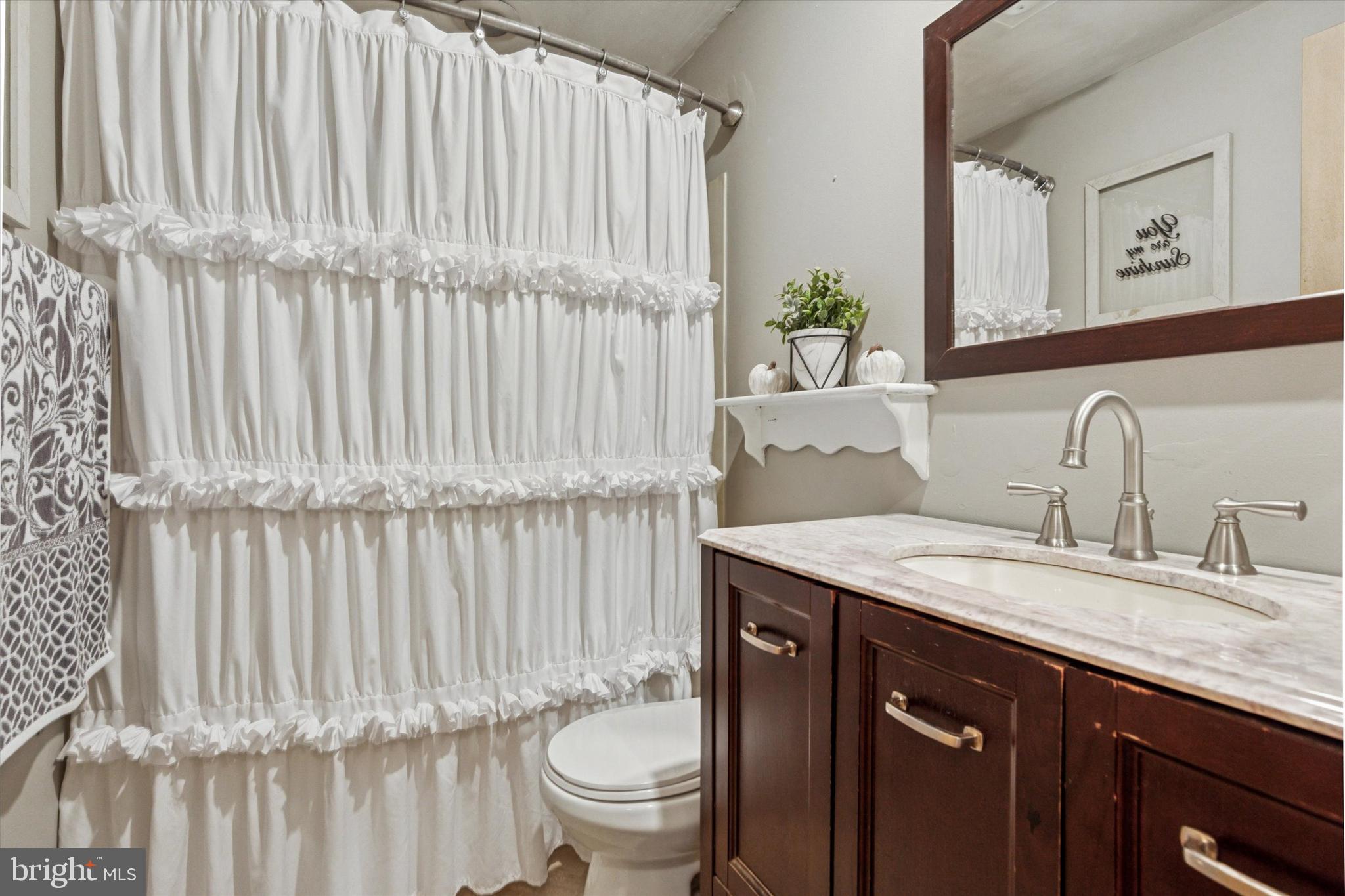 105 Cambridge Road Coatesville, PA 19320 - Photo 10 of 21 a bathroom with a granite countertop sink and a mirror