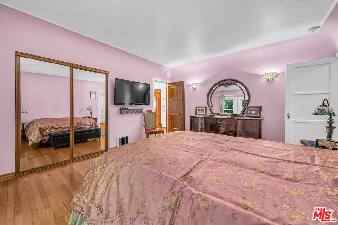 1163 Hi Point Street Los Angeles, CA 90035 - Photo 13 of 29 a bedroom with a bed and a dresser