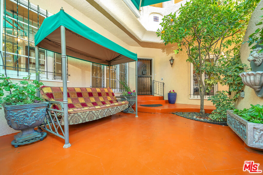 1163 Hi Point Street Los Angeles, CA 90035 - Photo 23 of 29 a view of a house with swimming pool and sitting area