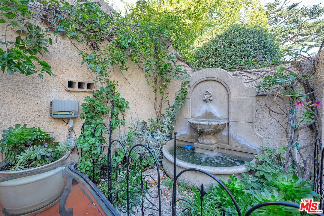1163 Hi Point Street Los Angeles, CA 90035 - Photo 26 of 29 an outdoor view of garden with patio