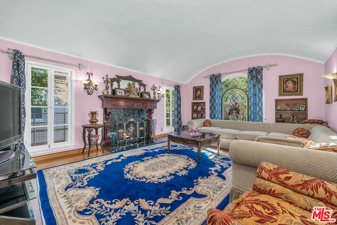 1163 Hi Point Street Los Angeles, CA 90035 - Photo 3 of 29 a living room with furniture and a fireplace