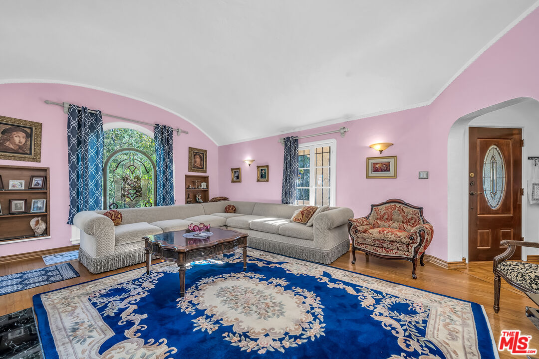 1163 Hi Point Street Los Angeles, CA 90035 - Photo 5 of 29 a living room with furniture rug and window