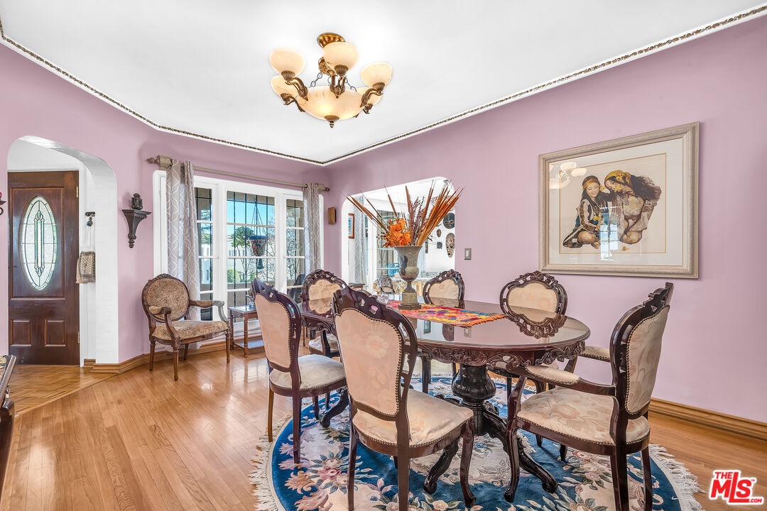1163 Hi Point Street Los Angeles, CA 90035 - Photo 7 of 29 a view of a dining room with furniture window and wooden floor
