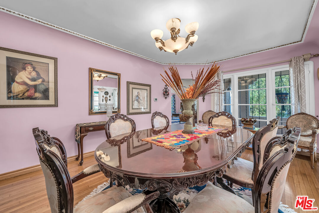1163 Hi Point Street Los Angeles, CA 90035 - Photo 8 of 29 a view of a dining room with furniture window and wooden floor