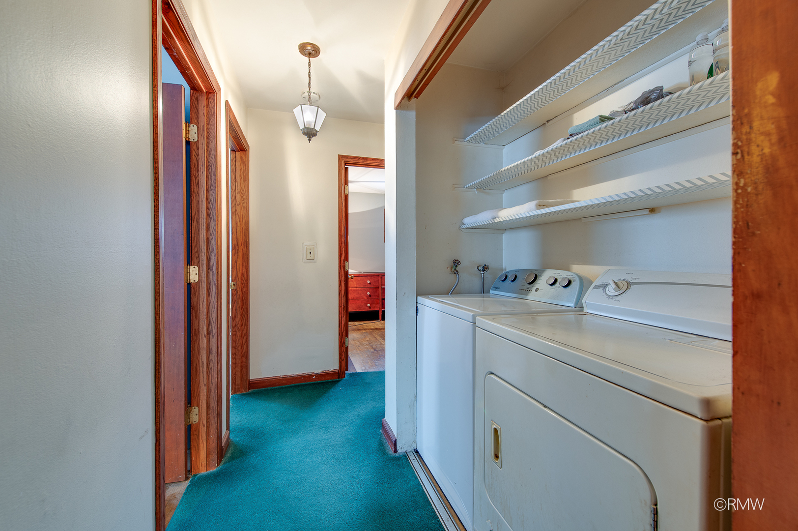 305 East Normandy Drive Addison, IL 60101 - Photo 12 of 24 a view of storage and utility room with washer and dryer