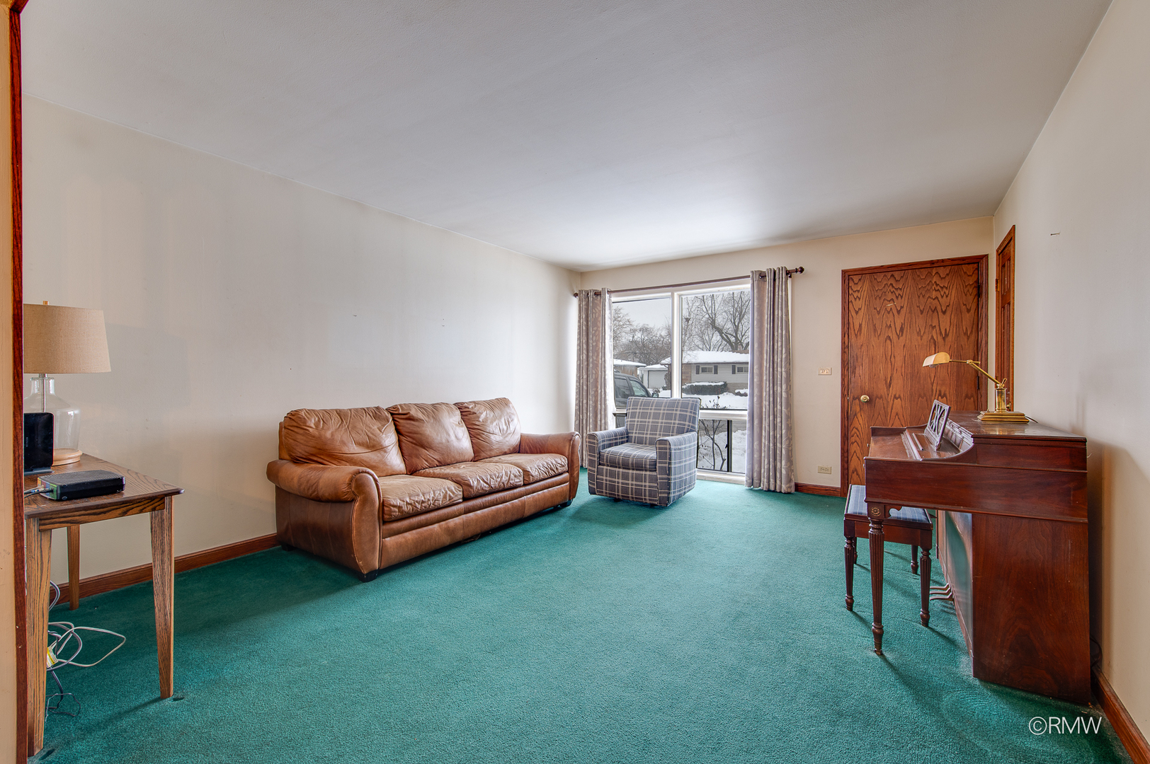 305 East Normandy Drive Addison, IL 60101 - Photo 3 of 24 a living room with furniture and a wooden floor