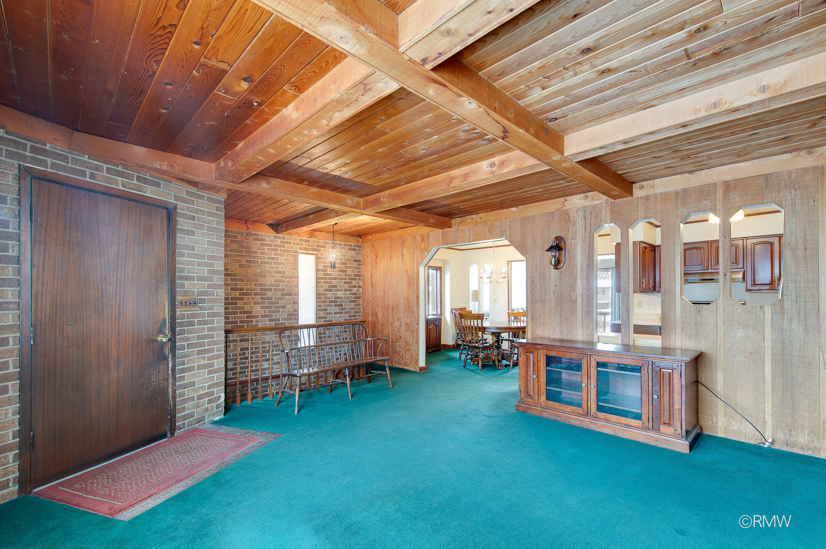 305 East Normandy Drive Addison, IL 60101 - Photo 7 of 24 a view of an empty room with furniture and stairs