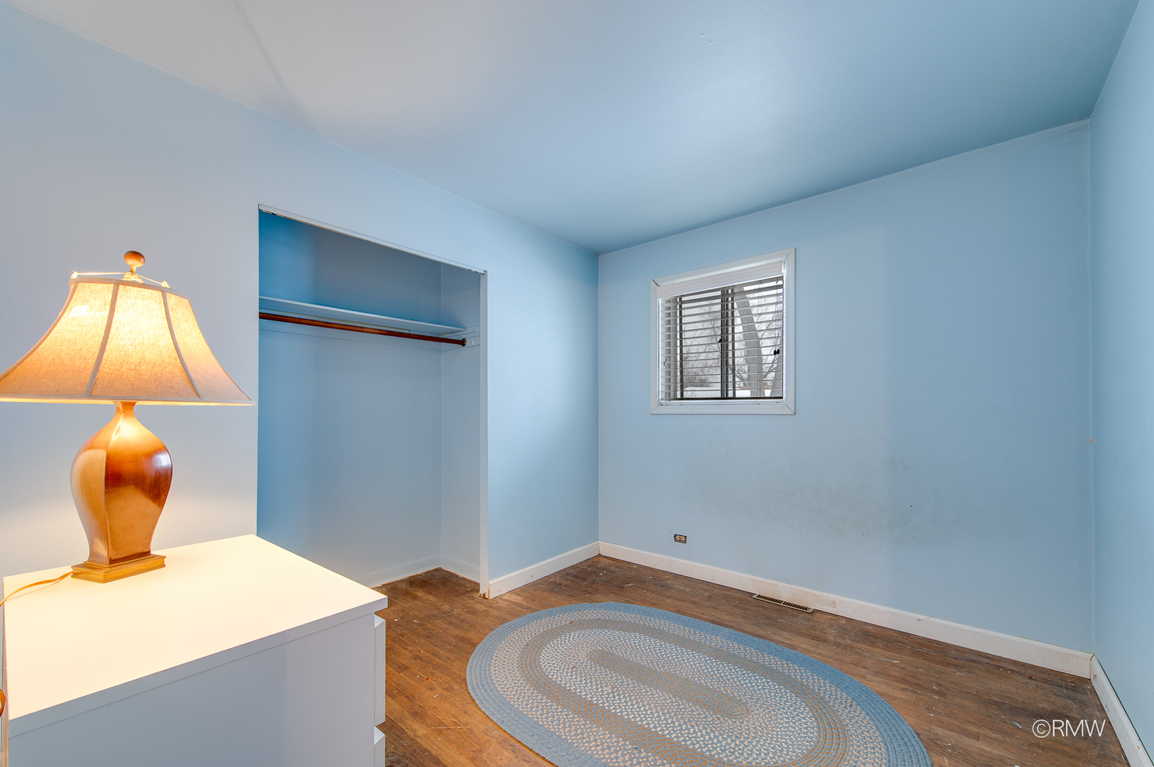 305 East Normandy Drive Addison, IL 60101 - Photo 10 of 24 a bathroom with a sink and a mirror