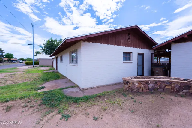 a backyard of a house with wooden fence
