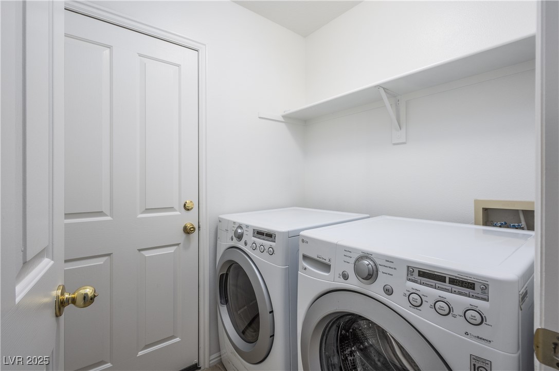 490 Ruby Drive Mesquite, NV 89027 - Photo 15 of 23 Laundry area with washing machine and clothes dryer