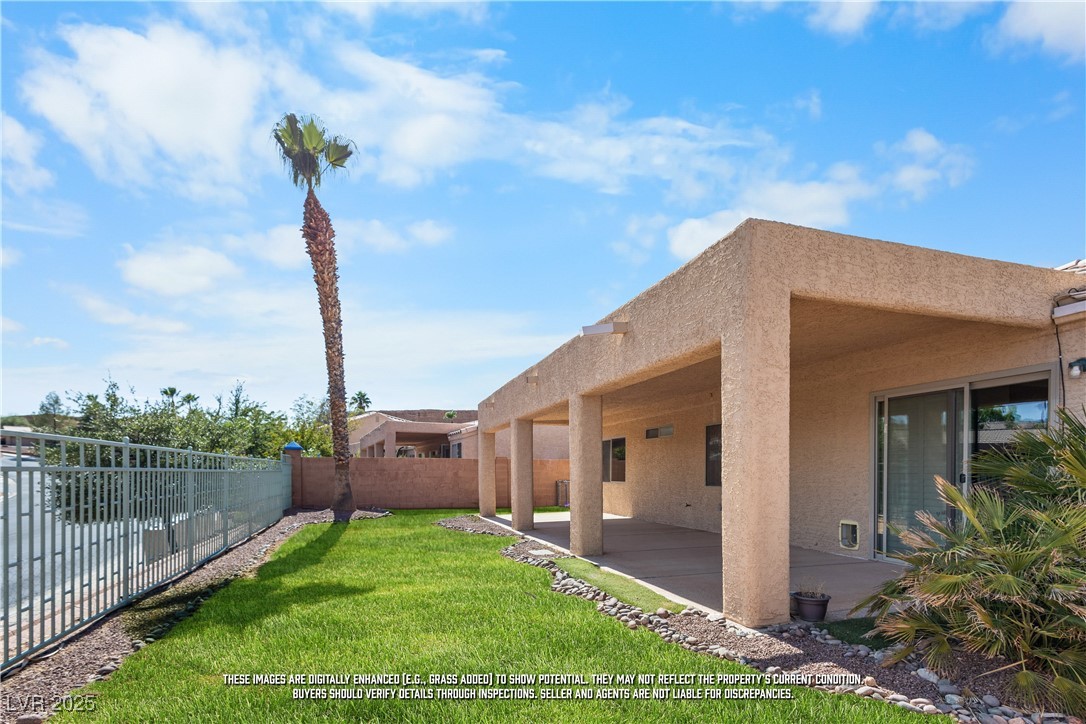 490 Ruby Drive Mesquite, NV 89027 - Photo 21 of 23 Fenced backyard featuring a patio area