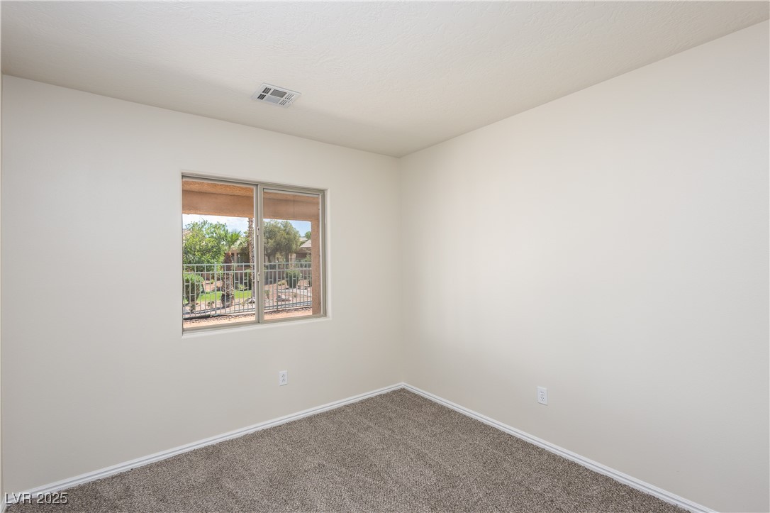 490 Ruby Drive Mesquite, NV 89027 - Photo 8 of 23 Carpeted empty room with baseboards