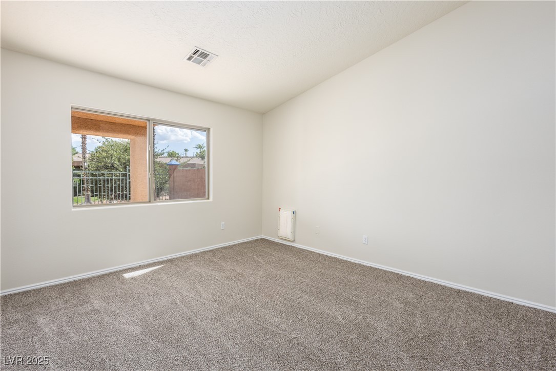 490 Ruby Drive Mesquite, NV 89027 - Photo 10 of 23 Spare room with baseboards and carpet flooring