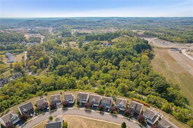 an aerial view of a city with lots of residential buildings