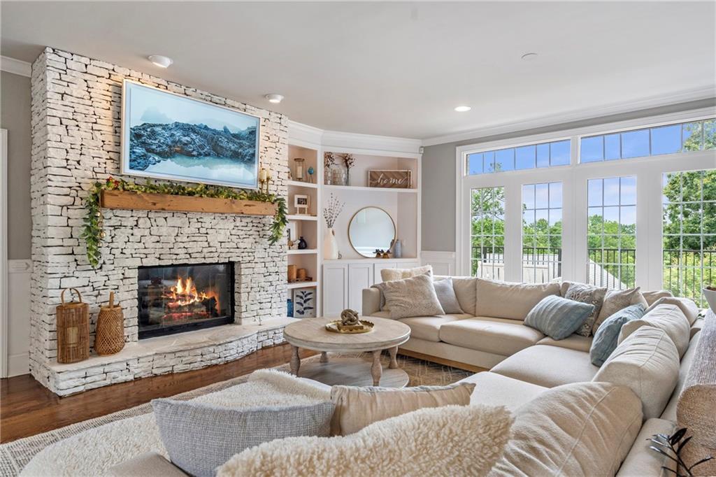 6026 GC Crow Road Flowery Branch, GA 30542 - Photo 12 of 100 a living room with furniture and a fireplace