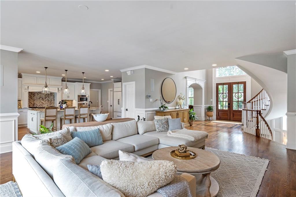 6026 GC Crow Road Flowery Branch, GA 30542 - Photo 14 of 100 a living room with furniture kitchen view and a wooden floor