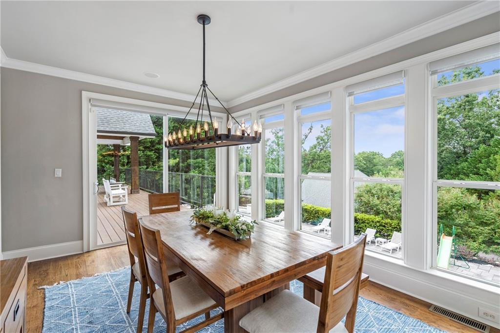 6026 GC Crow Road Flowery Branch, GA 30542 - Photo 20 of 100 a view of a dining room with furniture window and wooden floor