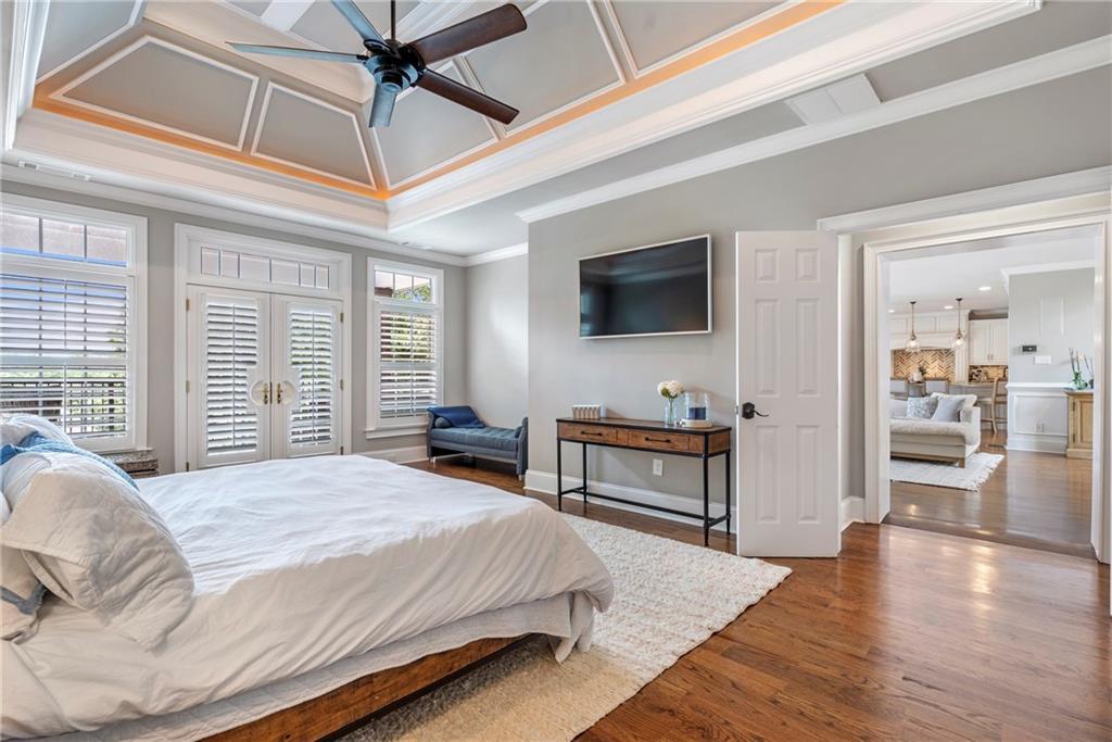 6026 GC Crow Road Flowery Branch, GA 30542 - Photo 29 of 100 a bedroom with a bed and a flat screen tv