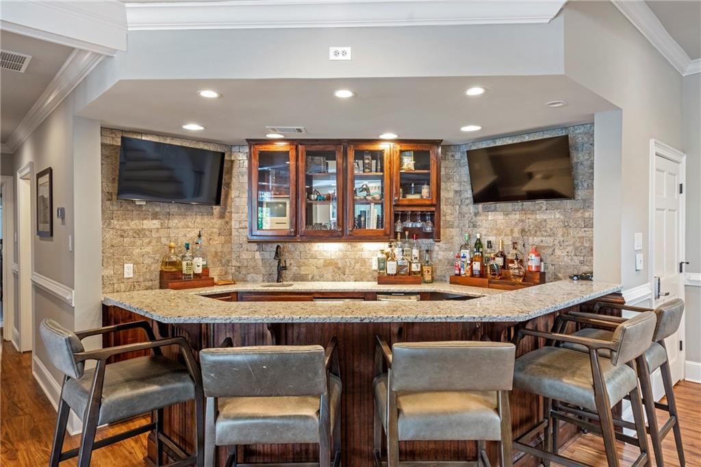 6026 GC Crow Road Flowery Branch, GA 30542 - Photo 38 of 100 a kitchen with a table and chairs in it