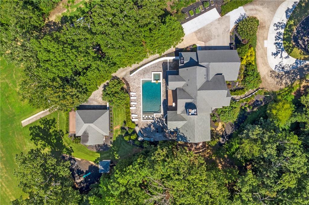 6026 GC Crow Road Flowery Branch, GA 30542 - Photo 5 of 100 an aerial view of a house with a yard and garden