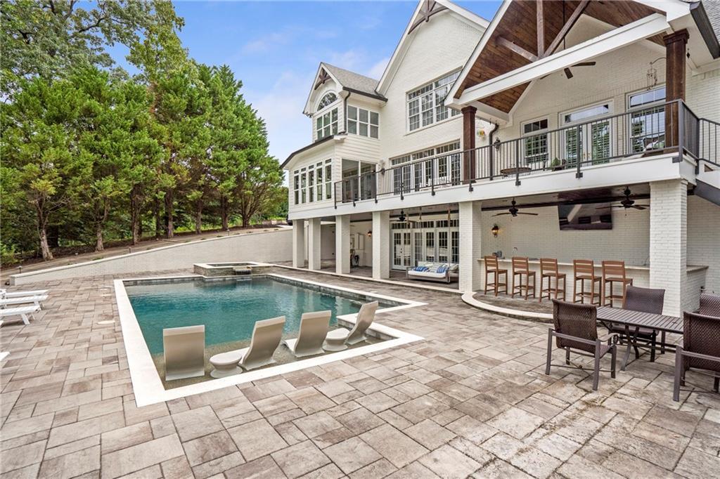 6026 GC Crow Road Flowery Branch, GA 30542 - Photo 53 of 100 a view of a house with backyard porch and sitting area
