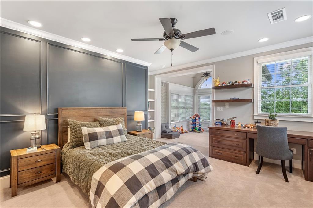 6026 GC Crow Road Flowery Branch, GA 30542 - Photo 65 of 100 a bedroom with a bed and a large window