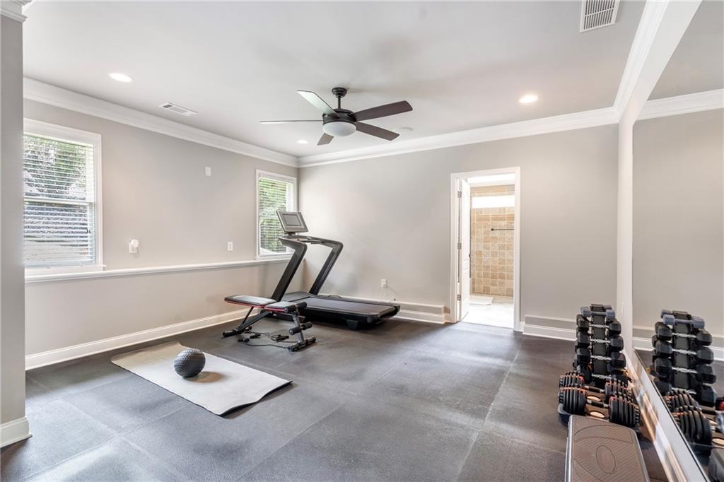 6026 GC Crow Road Flowery Branch, GA 30542 - Photo 78 of 100 a room with gym equipment and a large window
