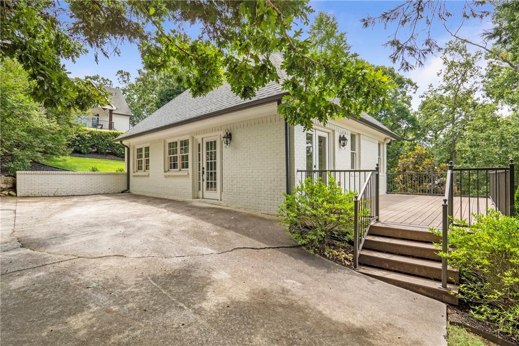 6026 GC Crow Road Flowery Branch, GA 30542 - Photo 80 of 100 a front view of a house with a garden