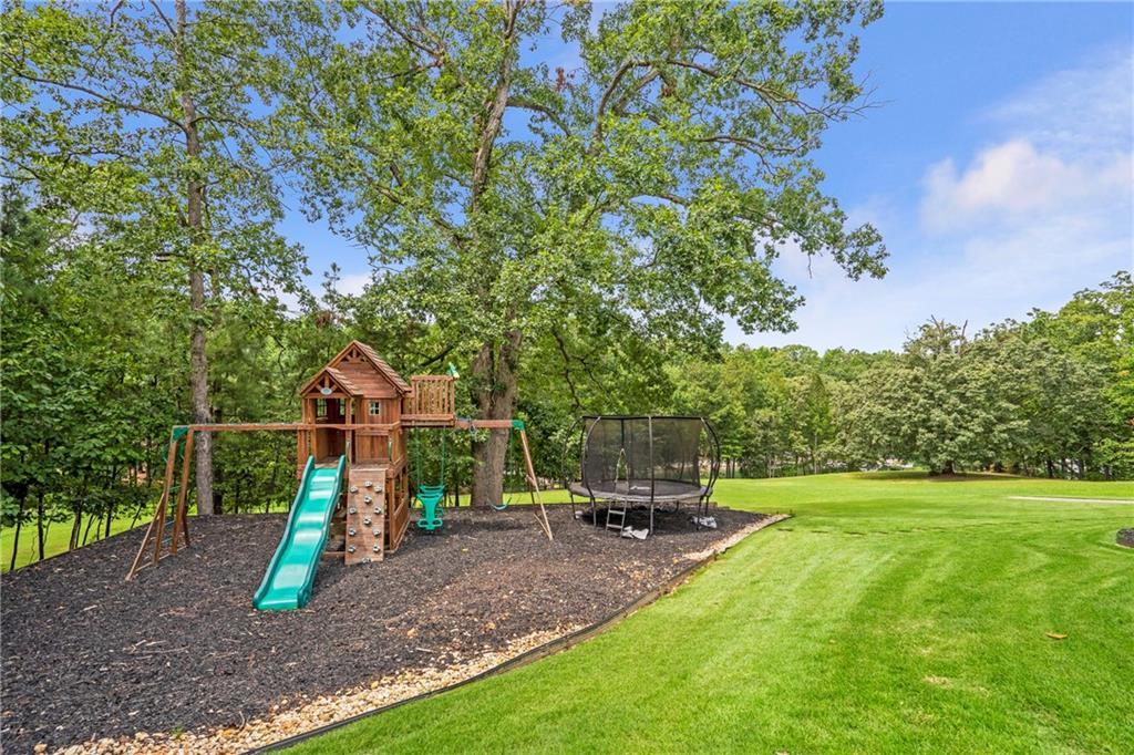 6026 GC Crow Road Flowery Branch, GA 30542 - Photo 83 of 100 a view of a park with swings