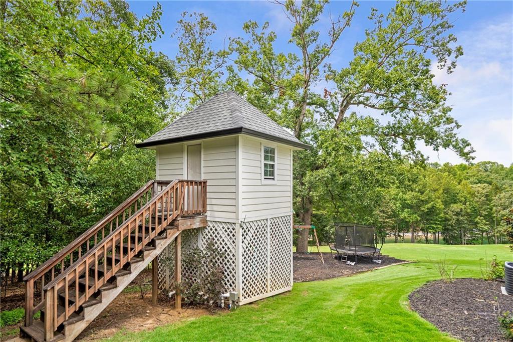 6026 GC Crow Road Flowery Branch, GA 30542 - Photo 84 of 100 a view of a house with a yard