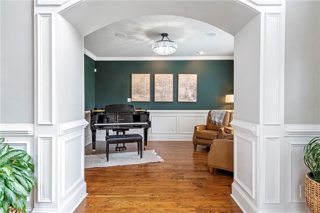 6026 GC Crow Road Flowery Branch, GA 30542 - Photo 9 of 100 a living room with furniture and a chandelier
