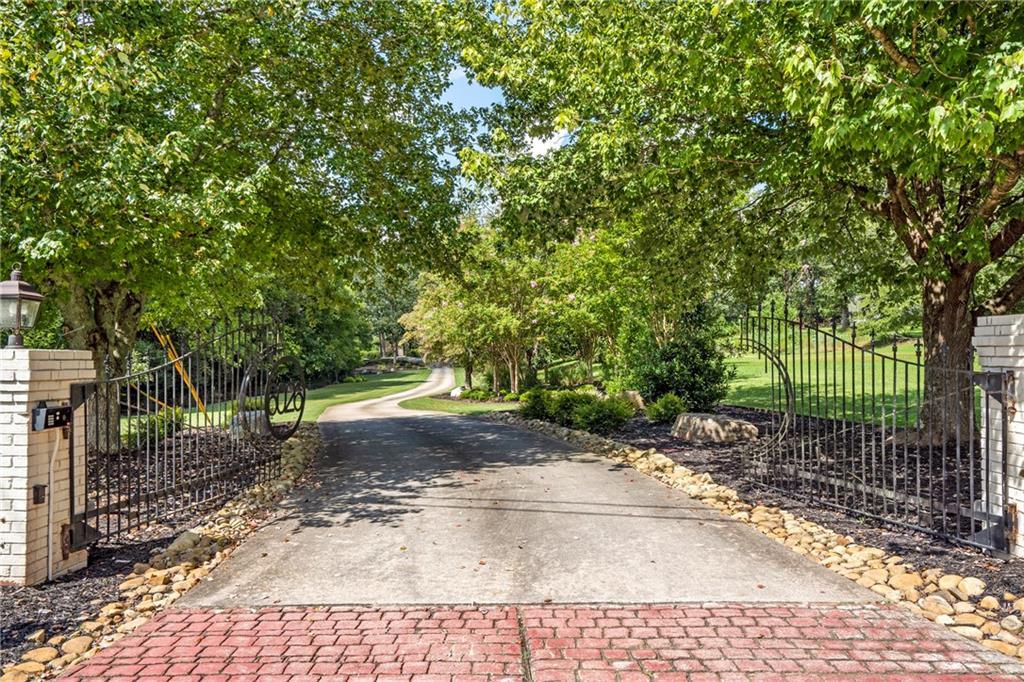 6026 GC Crow Road Flowery Branch, GA 30542 - Photo 91 of 100 a view of a yard with plants and trees