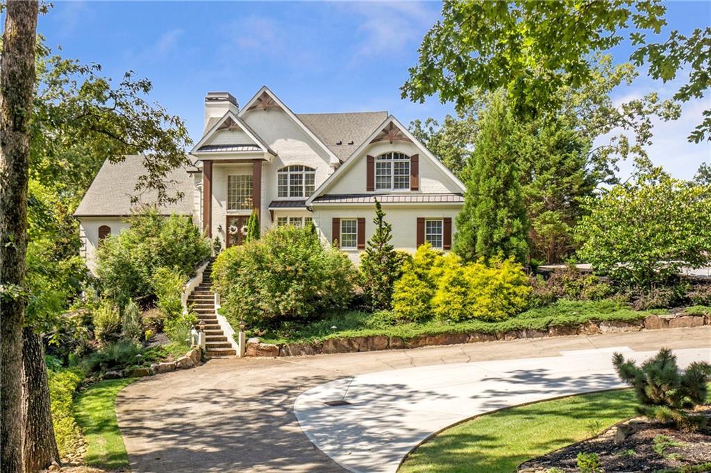 6026 GC Crow Road Flowery Branch, GA 30542 - Photo 93 of 100 a front view of a house with a garden