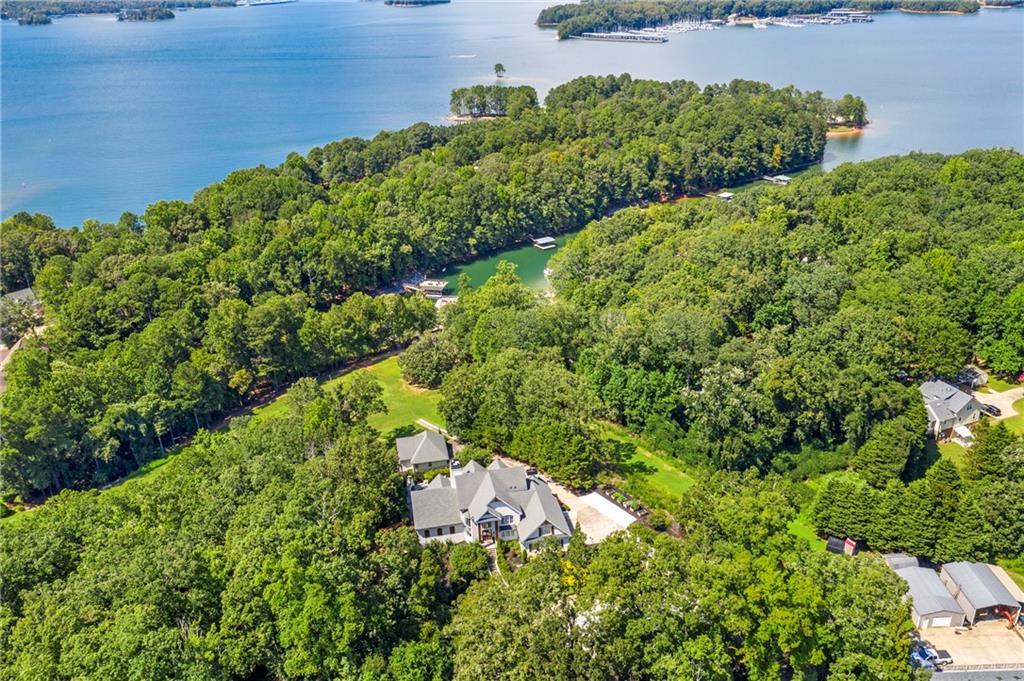 6026 GC Crow Road Flowery Branch, GA 30542 - Photo 94 of 100 a view of a garden with a building in the background