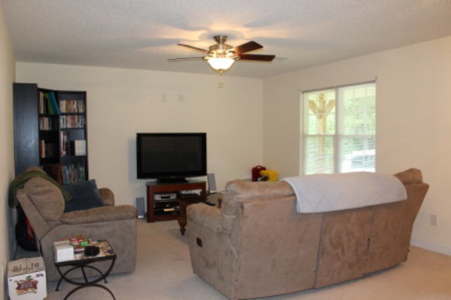 2965 Rumble Road Juliette, GA 31046 - Photo 2 of 8 a living room with furniture and a flat screen tv