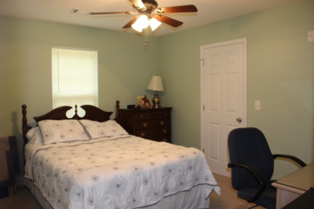2965 Rumble Road Juliette, GA 31046 - Photo 4 of 8 a bedroom with a bed and a closet
