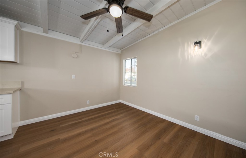 16924 Millstone Drive La Puente, CA 91744 - Photo 11 of 19 an empty room with a chandelier fan and windows