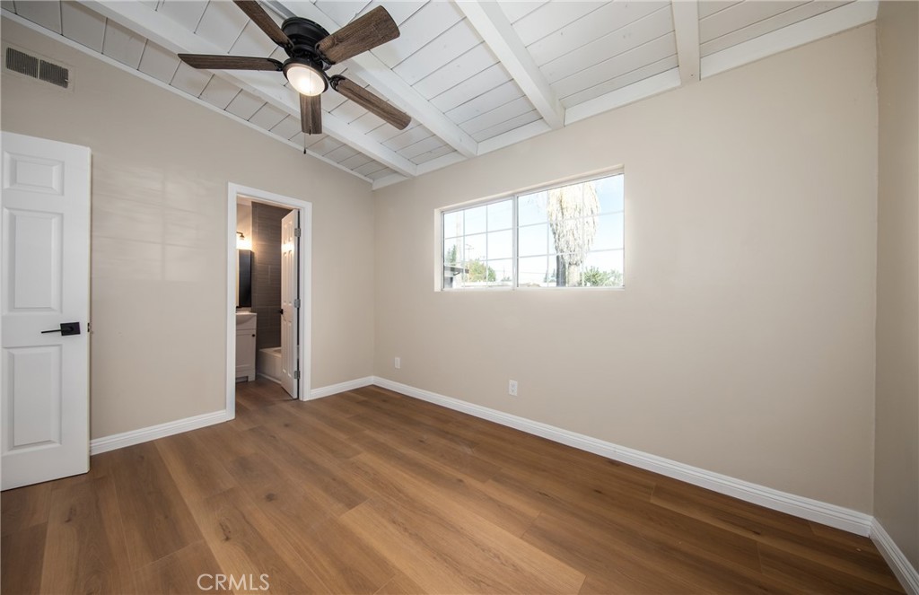 16924 Millstone Drive La Puente, CA 91744 - Photo 15 of 19 an empty room with wooden floor closet and windows