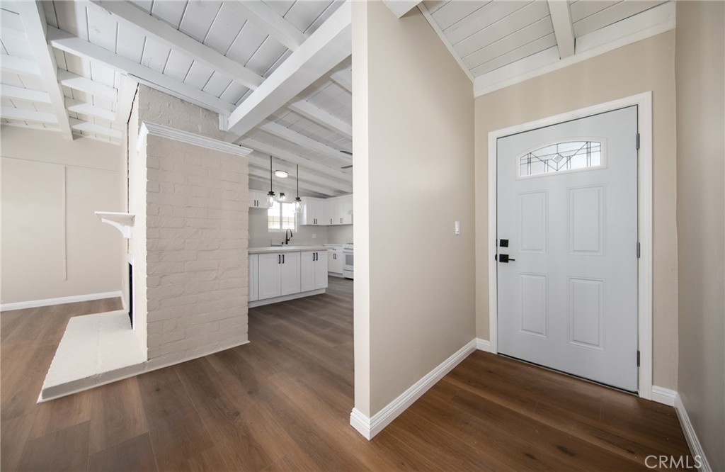 16924 Millstone Drive La Puente, CA 91744 - Photo 3 of 19 a view of a hallway with wooden floor and a bathroom