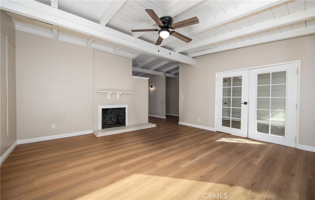 16924 Millstone Drive La Puente, CA 91744 - Photo 5 of 19 a view of an empty room with a fireplace and a window