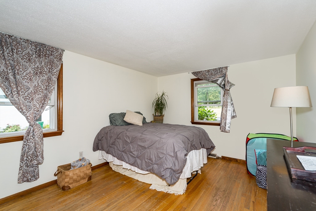 266 Mason Road Northbridge, MA 01588 - Photo 13 of 25 a bedroom with a bed and wooden floor