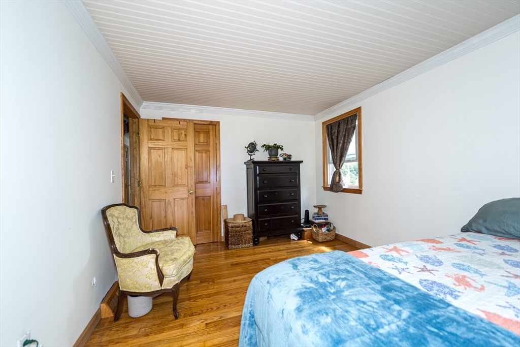 266 Mason Road Northbridge, MA 01588 - Photo 14 of 25 a bedroom with furniture and a flat screen tv
