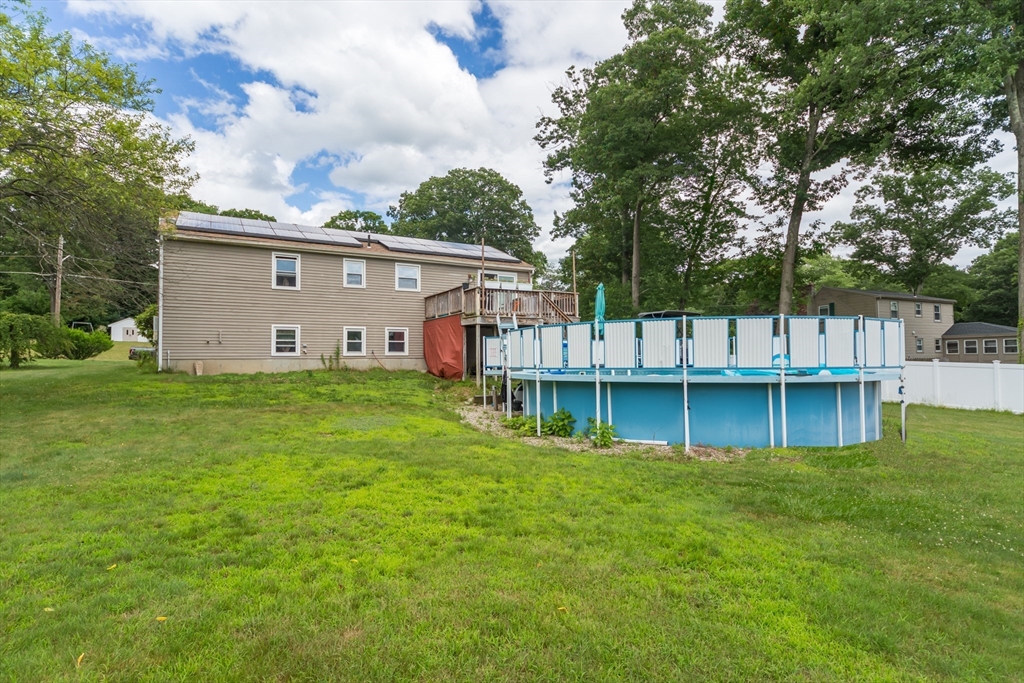 266 Mason Road Northbridge, MA 01588 - Photo 23 of 25 a view of a house with a big yard and large trees
