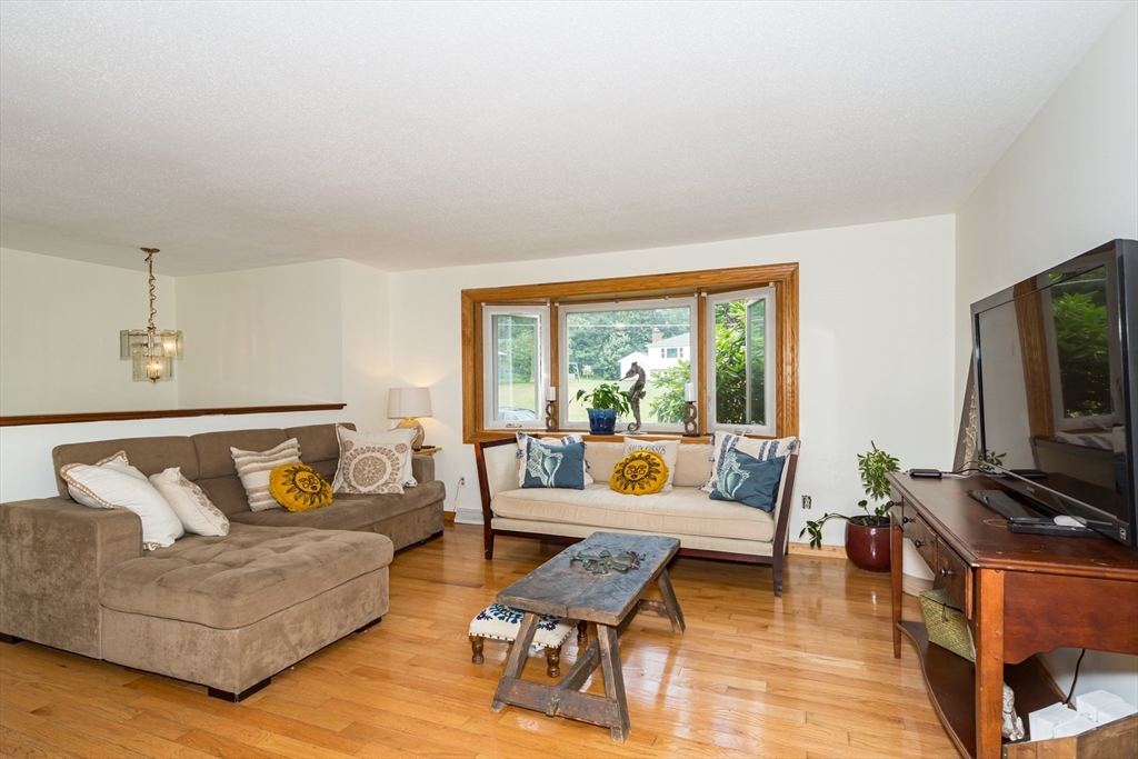 266 Mason Road Northbridge, MA 01588 - Photo 5 of 25 a living room with furniture and a flat screen tv
